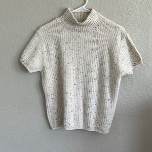 It works for me short sleeve, mockneck sweater